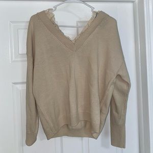 Beige sweater with lace lining around v neck